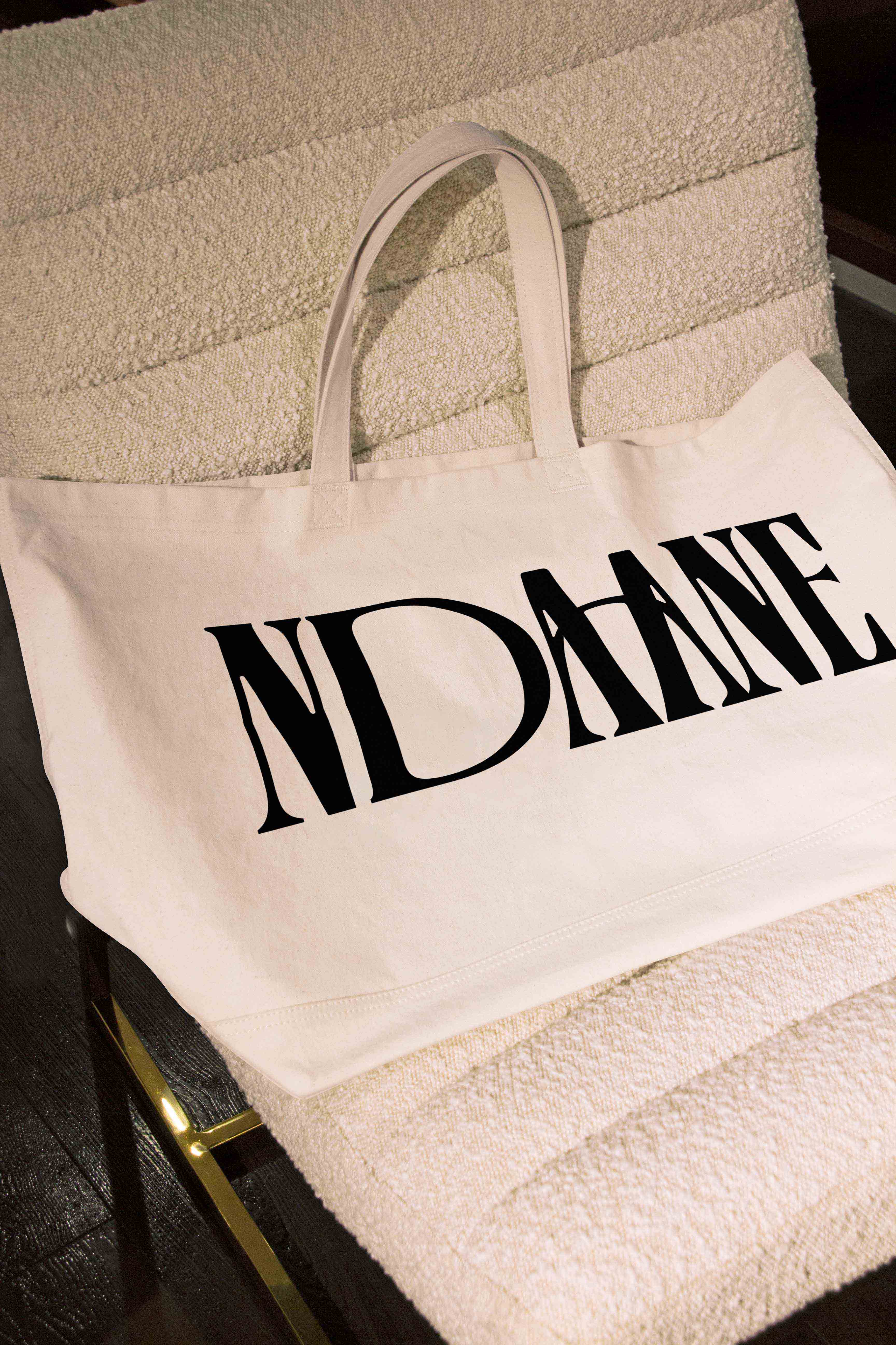 A tote bag on a cushioned chair