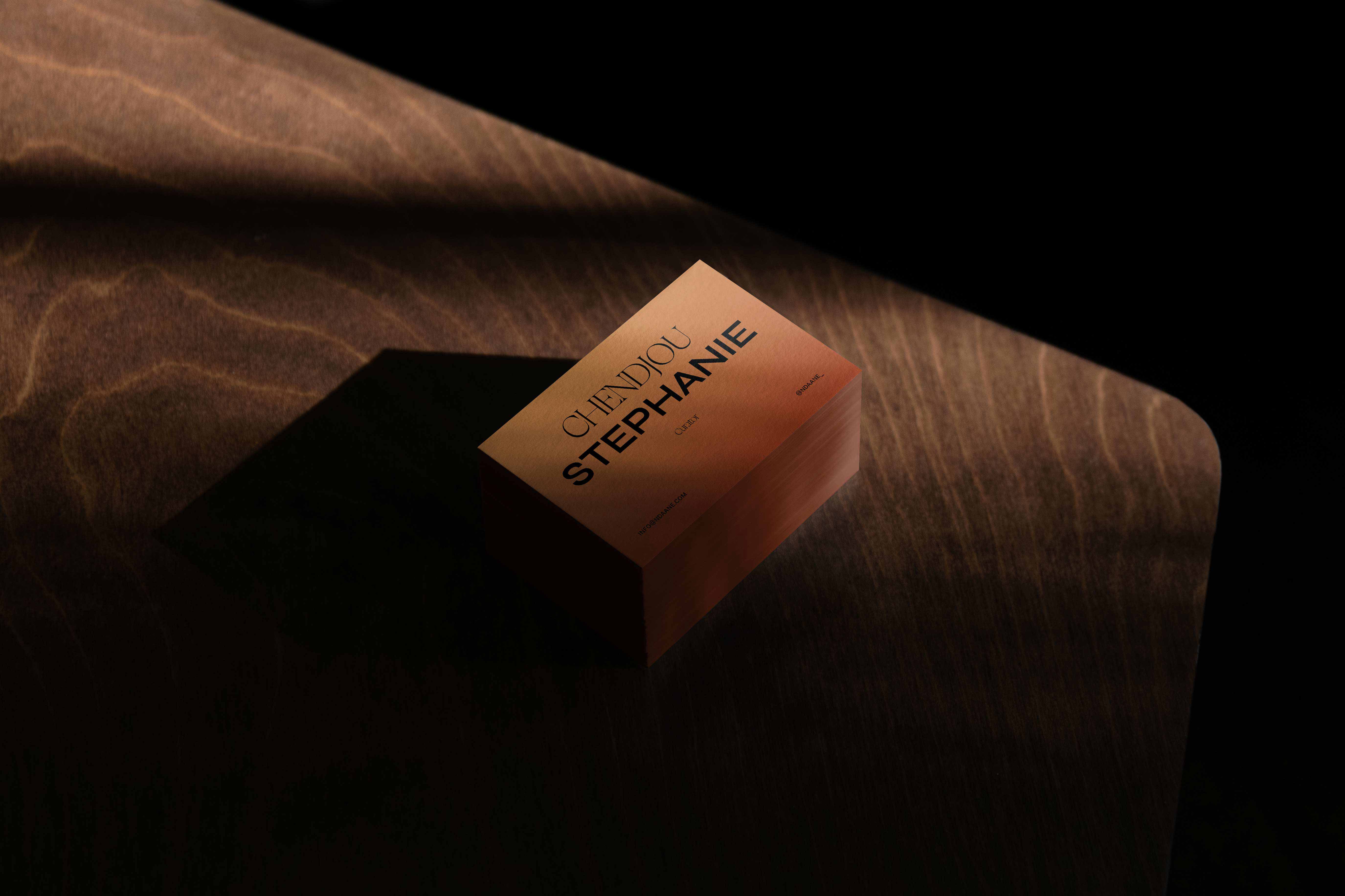 A shadowed setting with business cards on a table