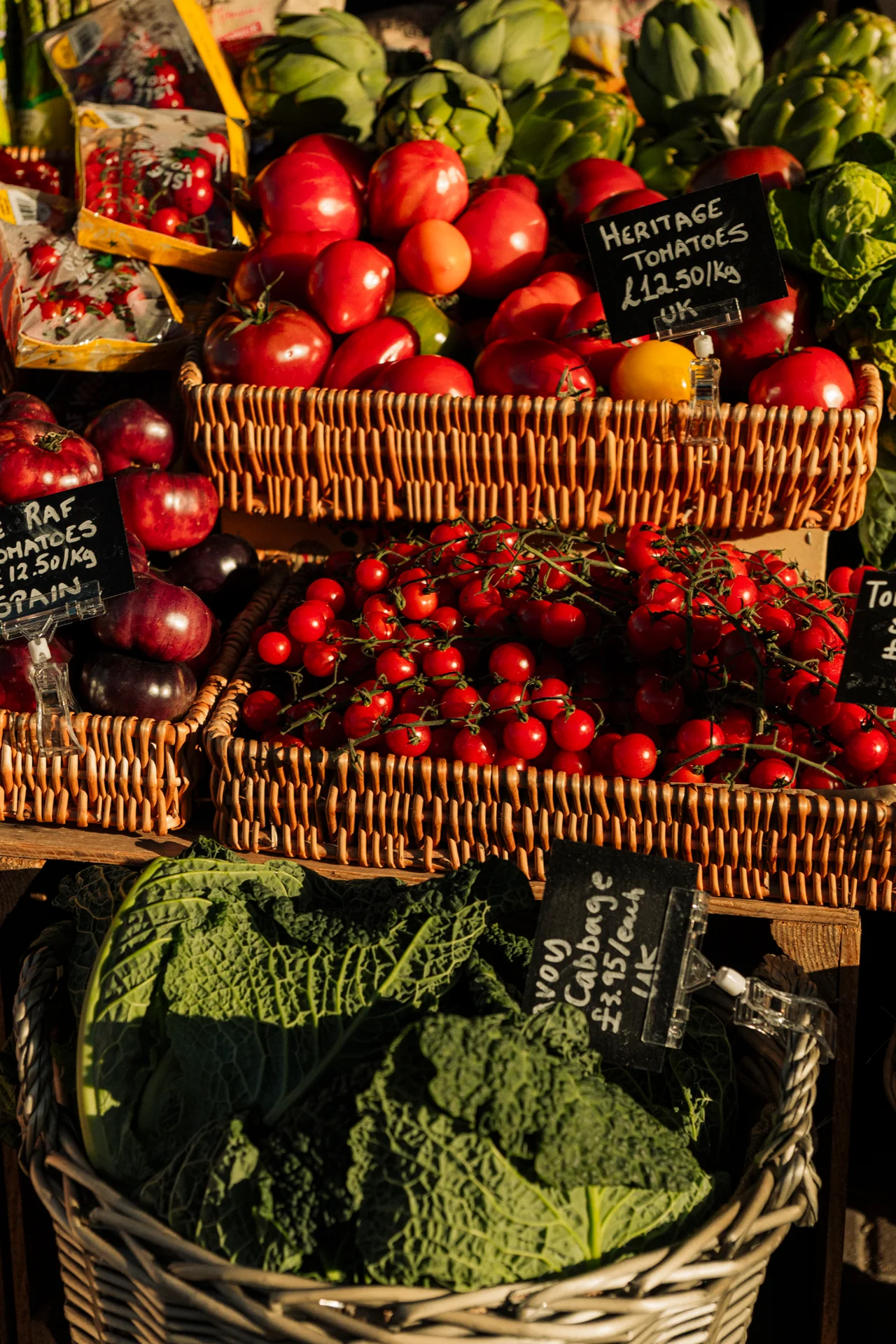 Heritage tomatoes in wicker baskets on the market stall
